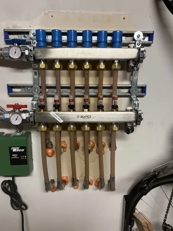 Plumber performing Water Heater Repair at a residential property in Collier